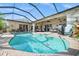 Beautiful screened-in pool and patio area, perfect for relaxing and entertaining outdoors at 290 Rotonda E Blvd, Rotonda West, FL 33947