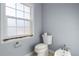 Small bathroom with toilet, sink, and bidet at 298 Fry Se Ter, Port Charlotte, FL 33952