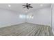 Bright bedroom with light walls, ceiling fan, and wood-look floors at 298 Fry Se Ter, Port Charlotte, FL 33952