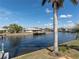 Peaceful waterfront view with lush landscaping at 298 Fry Se Ter, Port Charlotte, FL 33952