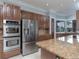 Modern kitchen with stainless steel appliances and granite countertops at 298 Fry Se Ter, Port Charlotte, FL 33952