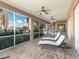 Relaxing lanai with lounge chairs, ceiling fans, and screened enclosure at 298 Fry Se Ter, Port Charlotte, FL 33952