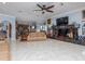 Spacious living room with fireplace and access to kitchen at 298 Fry Se Ter, Port Charlotte, FL 33952