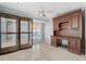 Home office with built-in wooden desk and display cabinets at 298 Fry Se Ter, Port Charlotte, FL 33952