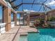 Enclosed pool and spa with a view of the house at 298 Fry Se Ter, Port Charlotte, FL 33952