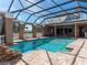 Enclosed pool and spa with a view of the house at 298 Fry Se Ter, Port Charlotte, FL 33952