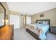 Spacious bedroom with king-size bed and ensuite bathroom at 311 Garvin St # 207B, Punta Gorda, FL 33950