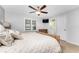 Comfortable Primary bedroom with a king bed and access to the bathroom at 3183 Sulstone Dr, Punta Gorda, FL 33983