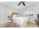 Cozy bedroom featuring a queen bed, window seat, and tasteful decor at 3183 Sulstone Dr, Punta Gorda, FL 33983