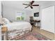 Bright bedroom with a queen-size bed, workspace, and ample closet space at 3183 Sulstone Dr, Punta Gorda, FL 33983