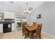 Bright dining area with wood table and chairs near kitchen at 3183 Sulstone Dr, Punta Gorda, FL 33983