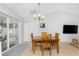 Dining area with wooden table and chairs near kitchen at 3183 Sulstone Dr, Punta Gorda, FL 33983