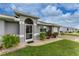 House exterior with landscaped yard and entryway at 3183 Sulstone Dr, Punta Gorda, FL 33983