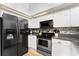 Modern kitchen with stainless steel appliances and white cabinets at 3183 Sulstone Dr, Punta Gorda, FL 33983