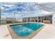 Enjoy this refreshing screened pool with a backyard view at 3183 Sulstone Dr, Punta Gorda, FL 33983