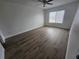 Bright bedroom with hardwood floors and ample natural light at 3261 Mill Run Ct, North Port, FL 34287