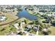 Neighborhood aerial view showcasing several homes, picturesque ponds, and mature landscaping at 336 Japura St, Punta Gorda, FL 33983