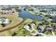 An aerial view of neighborhood showcasing serene ponds surrounded by lush landscaping and well-maintained homes at 336 Japura St, Punta Gorda, FL 33983