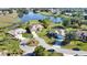 Wide aerial showcases homes with lake views and a cul-de-sac at 336 Japura St, Punta Gorda, FL 33983