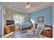 Bedroom with a large window, wood flooring, and coastal-themed decor at 336 Japura St, Punta Gorda, FL 33983