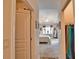 View from closet to bedroom featuring a trey ceiling and access to lanai at 336 Japura St, Punta Gorda, FL 33983