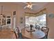 Inviting breakfast nook with wood table and view of the outdoor living space at 336 Japura St, Punta Gorda, FL 33983