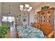 Open-concept dining room flowing to the living room offering serene views and ample natural light at 336 Japura St, Punta Gorda, FL 33983