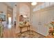 Inviting entryway featuring a decorative table, archways, and wood-look floors creates a warm welcome at 336 Japura St, Punta Gorda, FL 33983