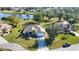 Aerial view of a well-kept house with landscaping and lake view at 336 Japura St, Punta Gorda, FL 33983