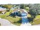 Aerial view of a home with manicured lawn and lush landscaping at 336 Japura St, Punta Gorda, FL 33983