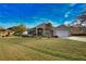 Charming single-story home featuring a well-manicured lawn, a two-car garage, and tropical landscaping at 336 Japura St, Punta Gorda, FL 33983