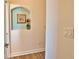 Hallway with wall niche and hardwood style flooring at 336 Japura St, Punta Gorda, FL 33983