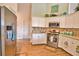 Well-lit kitchen featuring white cabinets, stainless steel appliances, and a practical layout at 336 Japura St, Punta Gorda, FL 33983