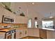 Bright kitchen featuring stainless steel appliances, tile backsplash, and white cabinetry at 336 Japura St, Punta Gorda, FL 33983