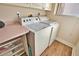 Well-equipped laundry room with side-by-side washer and dryer at 336 Japura St, Punta Gorda, FL 33983