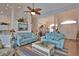 Living room area with bright furniture, view of dining room, and arched doorway at 336 Japura St, Punta Gorda, FL 33983