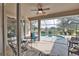 Patio area with an outdoor ceiling fan looking out to a private pool area at 336 Japura St, Punta Gorda, FL 33983