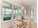 Eat-in kitchen features a dining area with water views and a pendant light at 37 Bocilla Dr, Placida, FL 33946