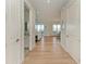 Bright foyer with hardwood floors offering a glimpse into the open-concept living area at 37 Bocilla Dr, Placida, FL 33946