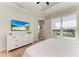 Well-lit main bedroom featuring a large dresser with mounted television and water view at 37 Bocilla Dr, Placida, FL 33946