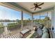 Relaxing screened porch with comfortable seating and views of the waterfront, an ideal outdoor retreat at 37 Bocilla Dr, Placida, FL 33946