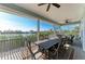 Spacious screened porch with seating and dining areas, offering stunning waterfront views at 37 Bocilla Dr, Placida, FL 33946