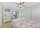 Comfortable bedroom with ceiling fan, tiled floors, closet, and view into the rest of the home at 3871 Bordeaux Dr, Punta Gorda, FL 33950