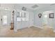 Hallway area with decoratives, cabinets and access to bathroom at 3871 Bordeaux Dr, Punta Gorda, FL 33950