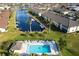 Aerial view of condo community with pool, dock, and canal at 4000 Bal Harbor Blvd # 225, Punta Gorda, FL 33950