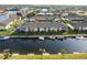 Aerial view of condo building, boat docks, and canal at 4000 Bal Harbor Blvd # 225, Punta Gorda, FL 33950