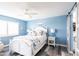 Bright bedroom with white bed frame and blue walls at 4000 Bal Harbor Blvd # 225, Punta Gorda, FL 33950