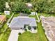 Aerial view of single-story home, pool, and fenced backyard at 4059 Twinbush Ter, North Port, FL 34286