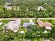 Aerial view of home, pool, and surrounding neighborhood at 4059 Twinbush Ter, North Port, FL 34286