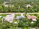 Aerial view of home, pool, and surrounding neighborhood at 4059 Twinbush Ter, North Port, FL 34286